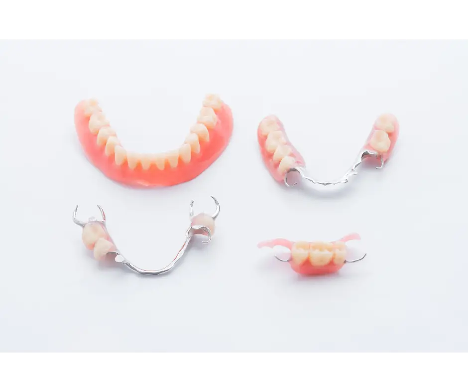 Set of natural-looking full dentures on a clean surface