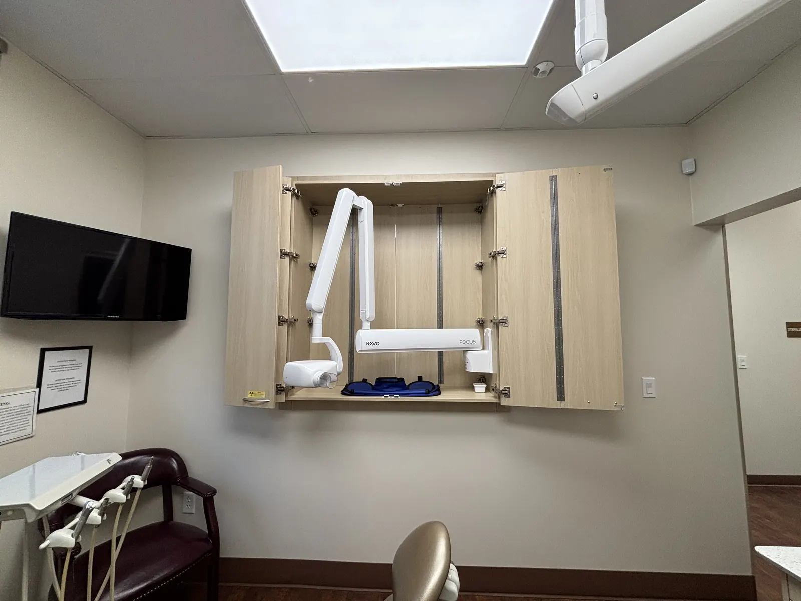 The digital X-ray imaging unit inside a treatment room at Valley Dental Turlock