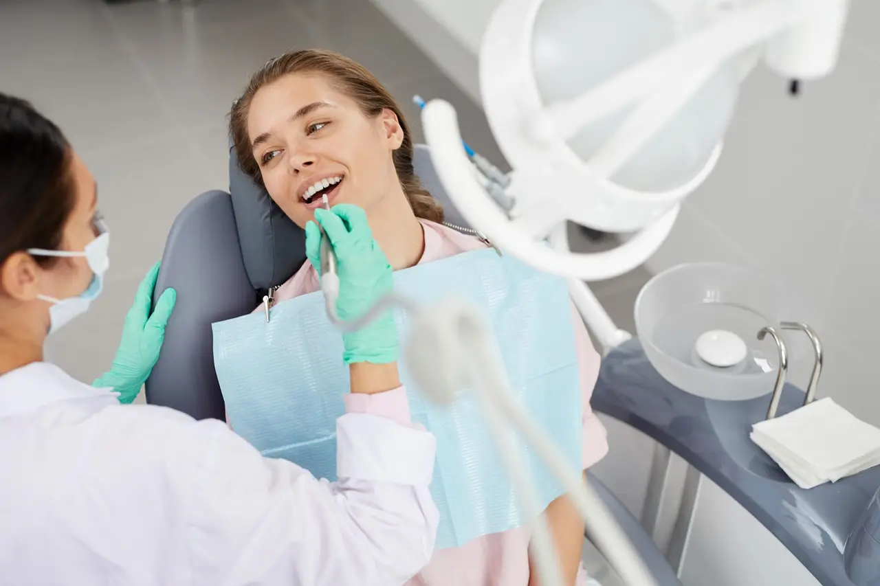 Young woman receiving a professional dental cleaning and exam in Turlock